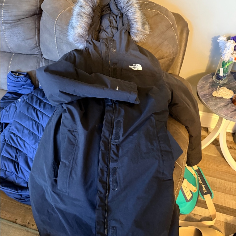 The North Face woman’s black parka with Faux Fur Hood
